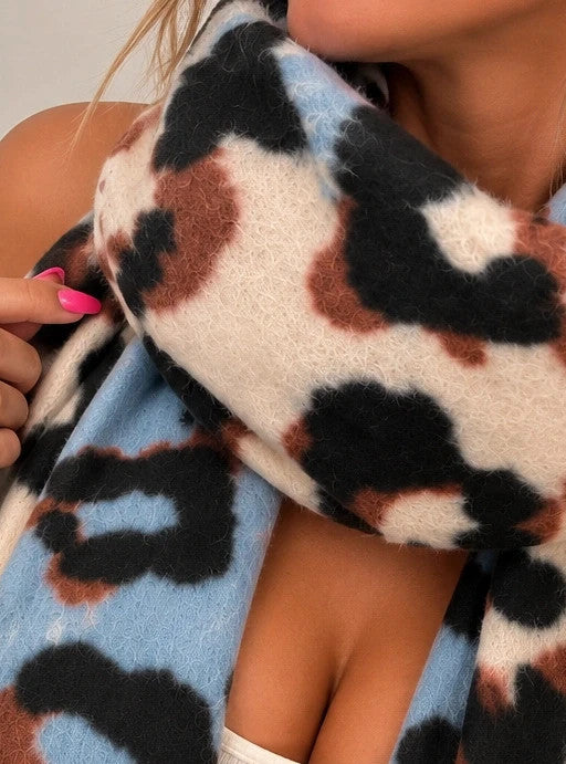 XXL multi shawl featuring bold leopard print in cream, light blue, brown, and black with fringe.