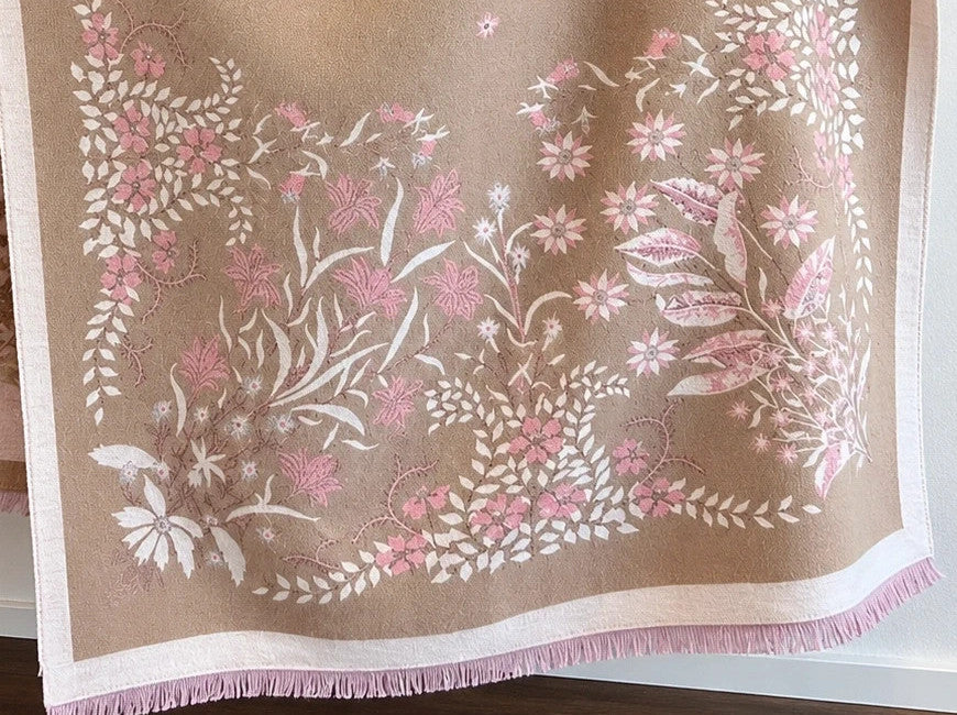 Beige shawl with pink floral pattern, reversible, soft polyester, fringed edges.