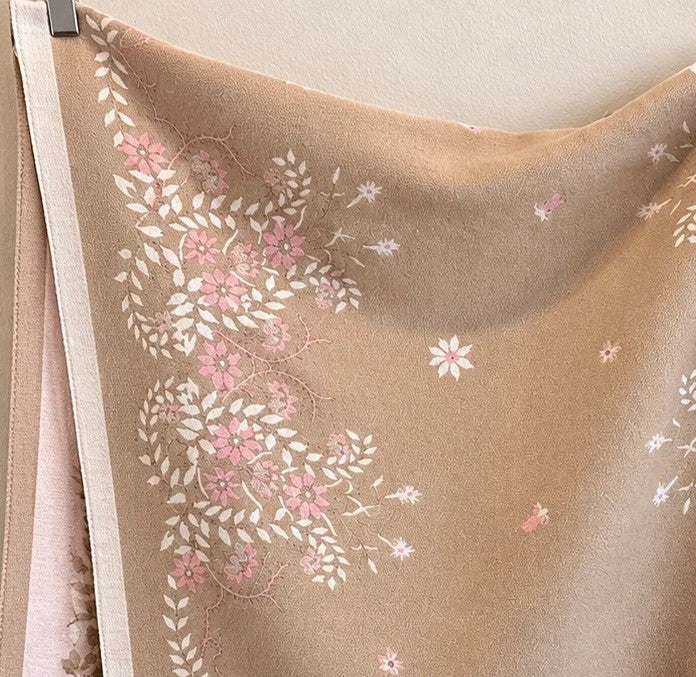 Beige shawl with pink floral pattern, reversible, soft polyester, fringed edges.