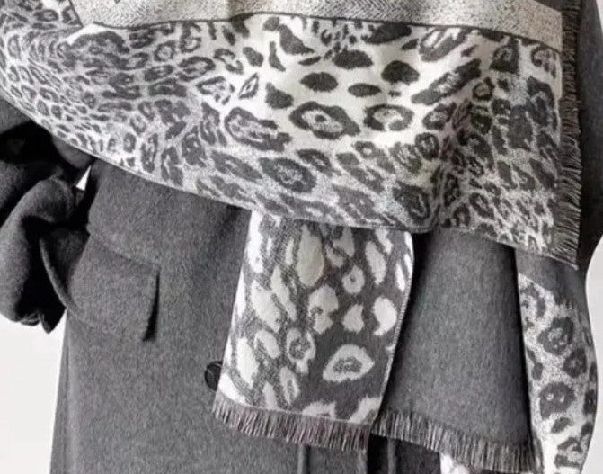 Creme reversible scarf grey and cream with leopard print and geometric patterns, fringed ends.