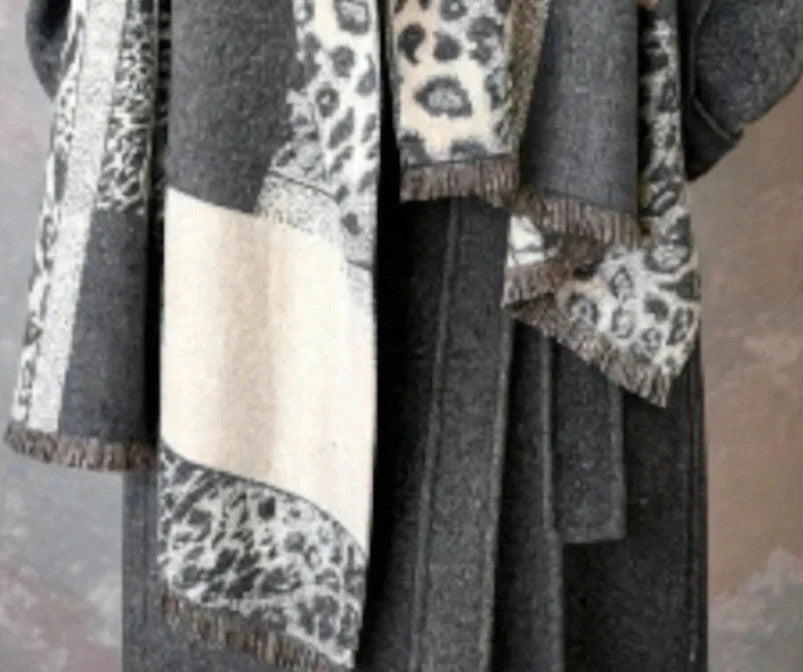 Creme reversible scarf grey and cream with leopard print and geometric patterns, fringed ends.