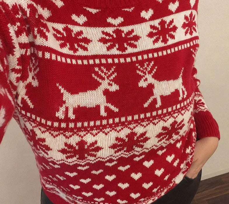 SheIn red and white Christmas sweater with reindeer, snowflakes, and ribbed cuffs.