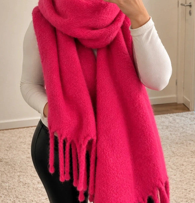 XXL pink fuchsia oversized scarf with long decorative fringes and soft fluffy texture.