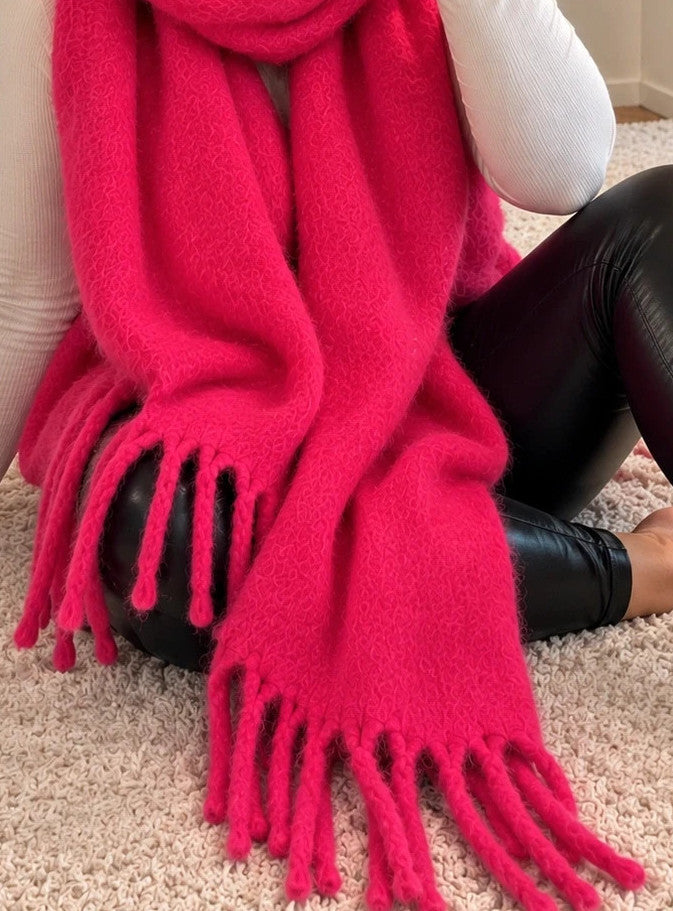 XXL pink fuchsia oversized scarf with long decorative fringes and soft fluffy texture.