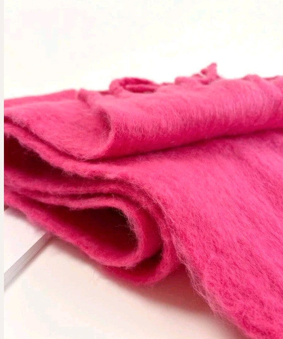 XXL pink fuchsia oversized scarf with long decorative fringes and soft fluffy texture.