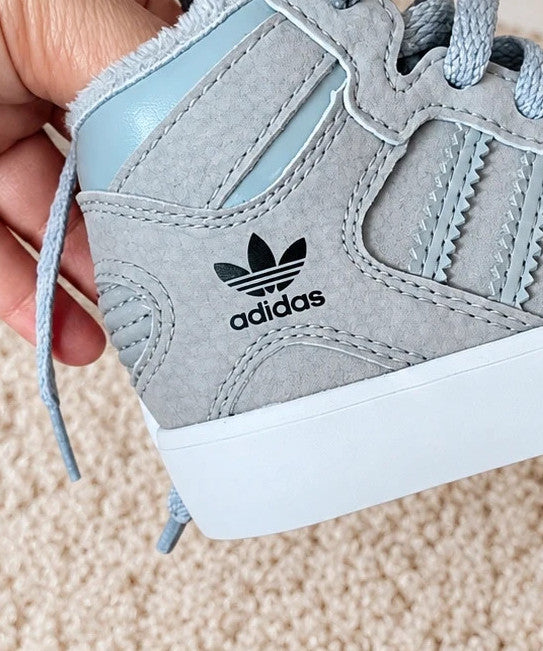 Adidas high top sneakers grey with soft lining, white rubber sole, and logo detail.
