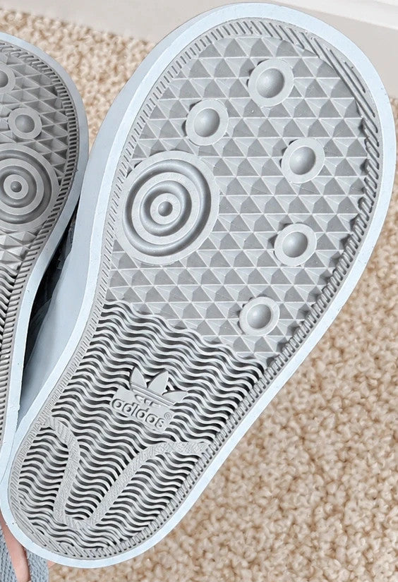 Adidas high top sneakers grey with soft lining, white rubber sole, and logo detail.