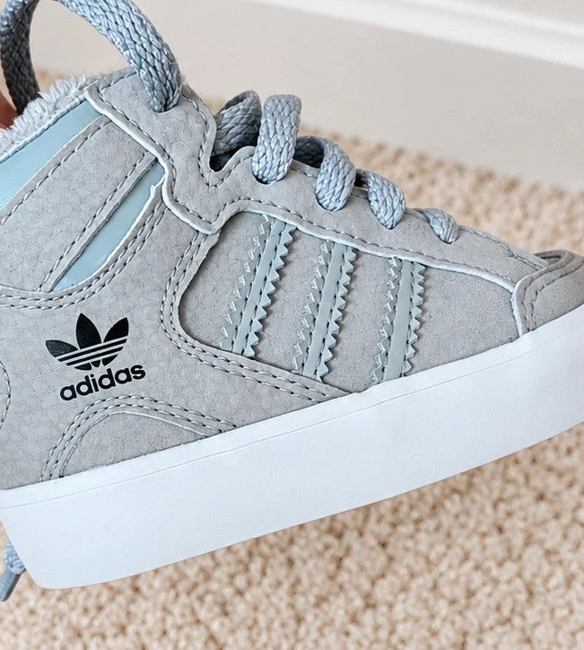 Adidas high top sneakers grey with soft lining, white rubber sole, and logo detail.