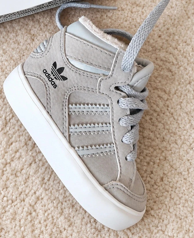 Adidas high top sneakers grey with soft lining, white rubber sole, and logo detail.