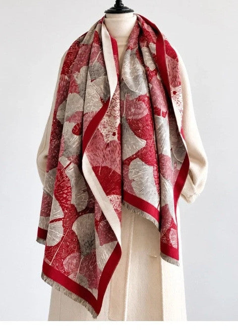 Creme shawl red, cream, grey with decorative leaf pattern and fringed edges.