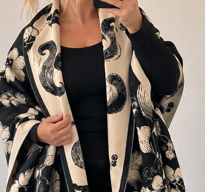 Creme black and cream shawl with floral pattern, soft polyester fabric.