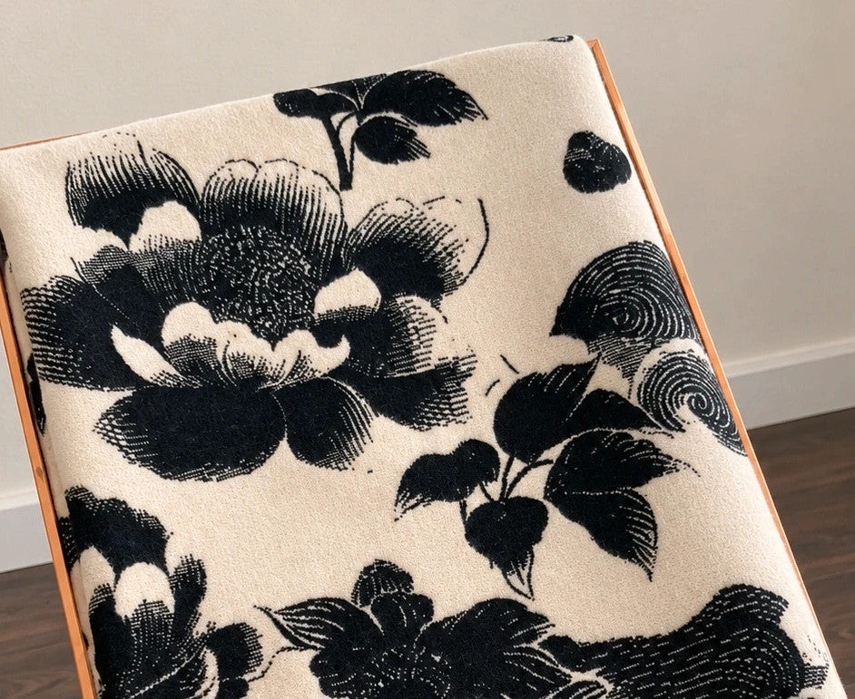 Creme black and cream shawl with floral pattern, soft polyester fabric.