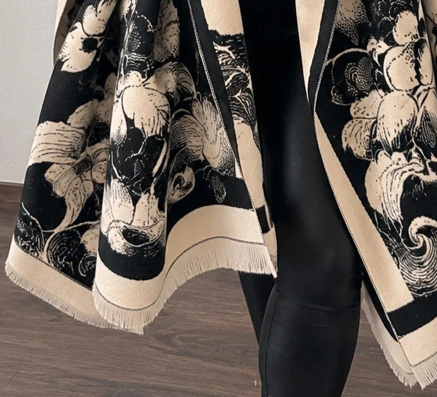 Creme black and cream shawl with floral pattern, soft polyester fabric.