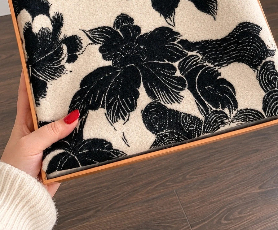 Creme black and cream shawl with floral pattern, soft polyester fabric.
