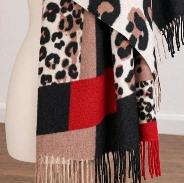 Muster multi shawl leopard print with fringe in red, beige, brown, cream, and black.