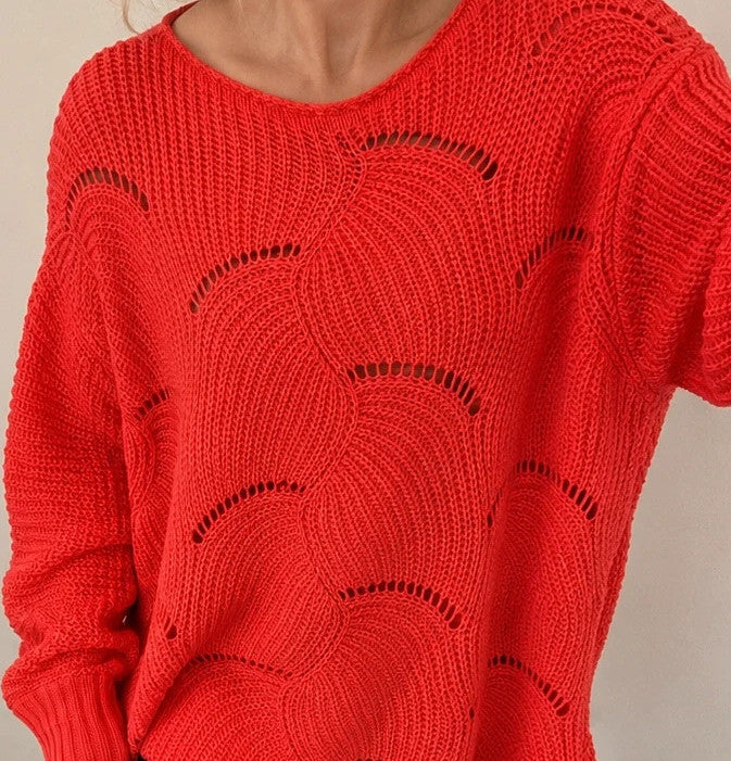 Pullover orange pink oversized sweater with decorative knit pattern and hole details.