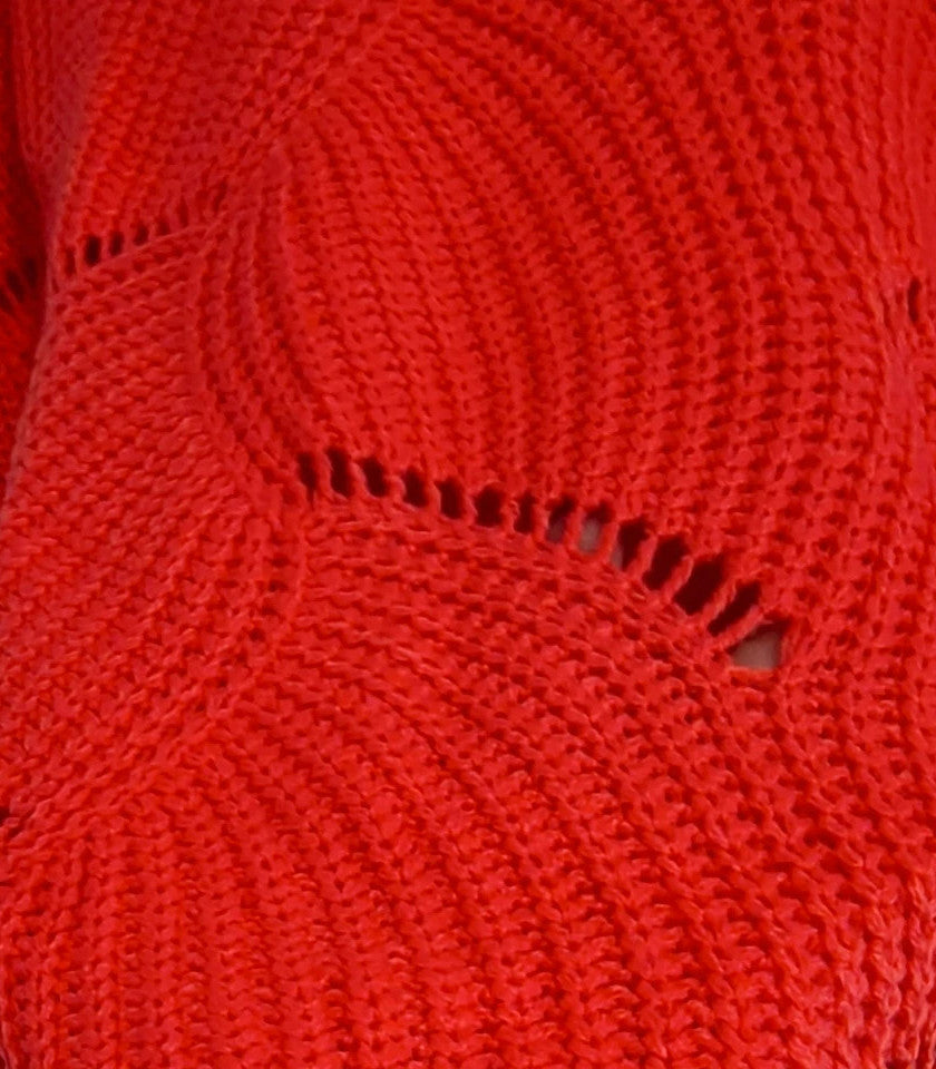Pullover orange pink oversized sweater with decorative knit pattern and hole details.