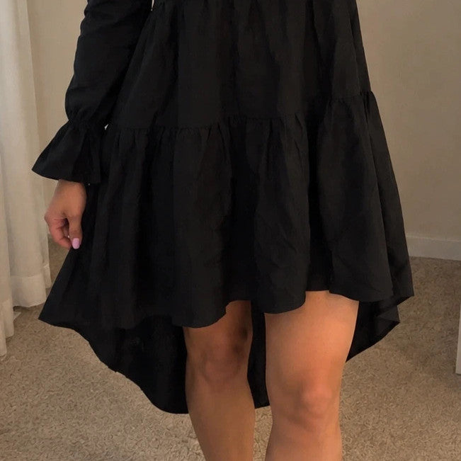 SheIn black oversized A-line dress with layered ruffle sleeves and asymmetrical hem.