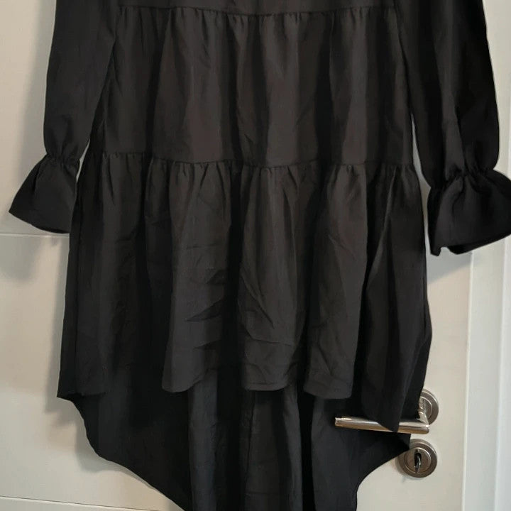 SheIn black oversized A-line dress with layered ruffle sleeves and asymmetrical hem.