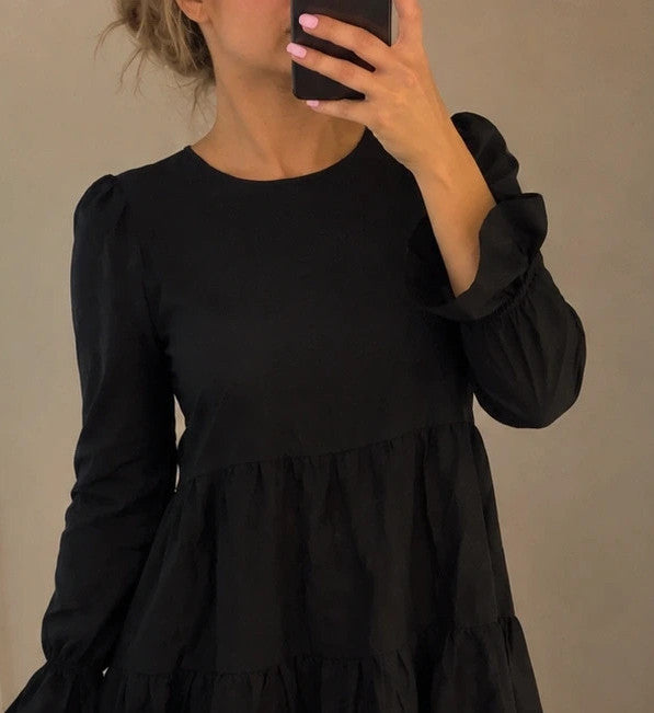 SheIn black oversized A-line dress with layered ruffle sleeves and asymmetrical hem.