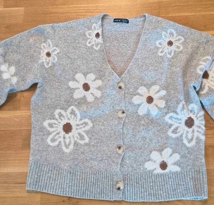 SheIn grey knit cardigan with large cream floral pattern and V-neck, soft material.