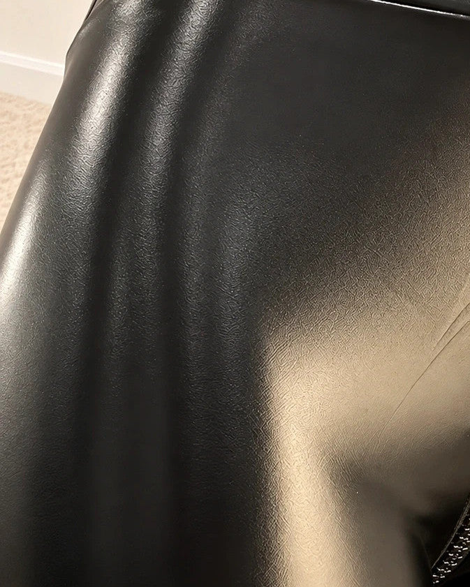 Leggings black bicycle tights high waist glossy finish with zipper detail and stretchy material.