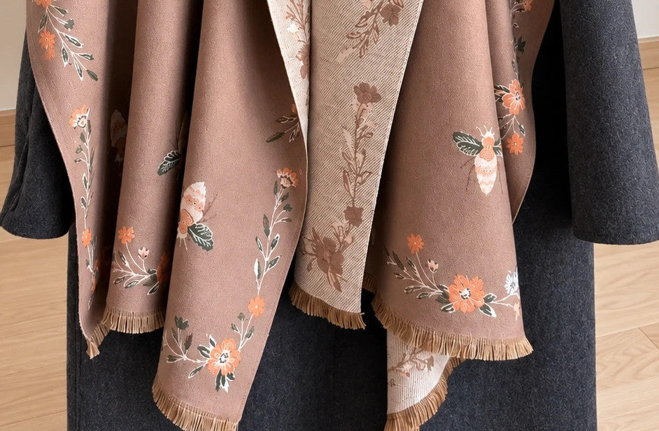 Beige shawl with brown bee and flower pattern, reversible design, fringed edges.