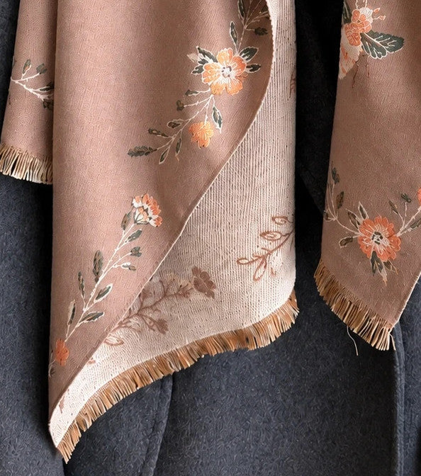 Beige shawl with brown bee and flower pattern, reversible design, fringed edges.