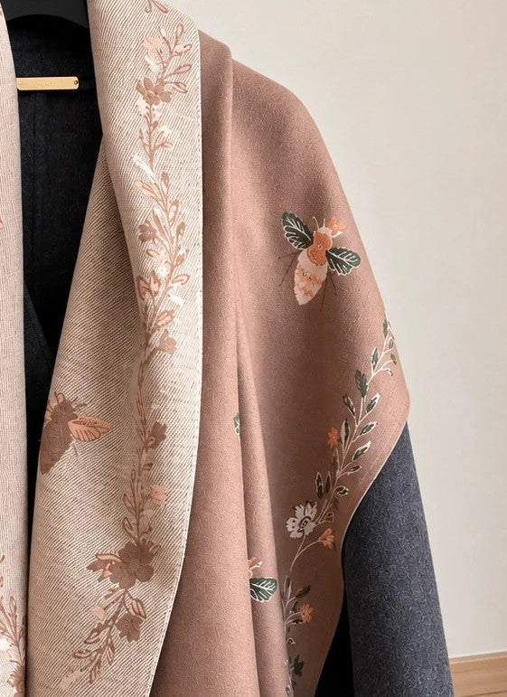Beige shawl with brown bee and flower pattern, reversible design, fringed edges.
