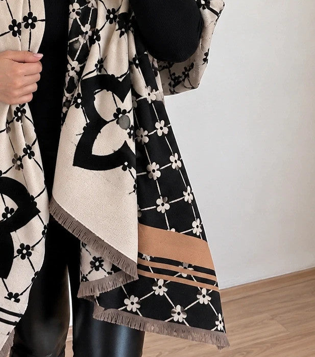 Creme shawl black cream beige floral pattern with decorative camel accents and fringes.