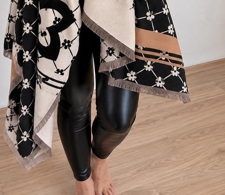 Creme shawl black cream beige floral pattern with decorative camel accents and fringes.