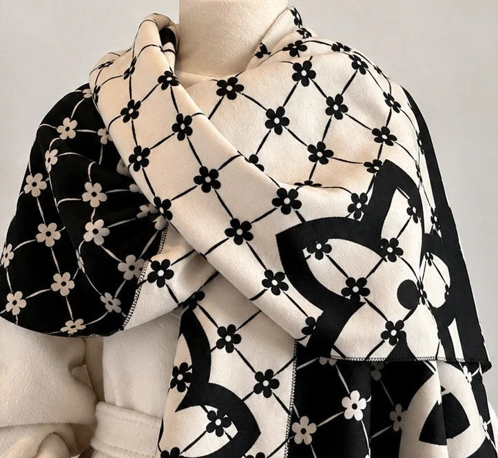 Creme shawl black cream beige floral pattern with decorative camel accents and fringes.