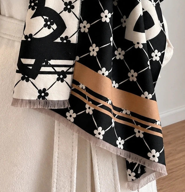 Creme shawl black cream beige floral pattern with decorative camel accents and fringes.
