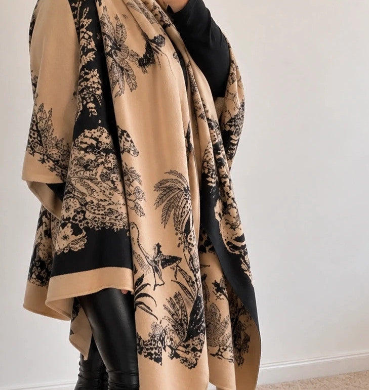 Beige shawl with black floral pattern, soft polyester material, versatile design.
