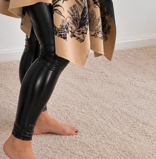 Beige shawl with black floral pattern, soft polyester material, versatile design.