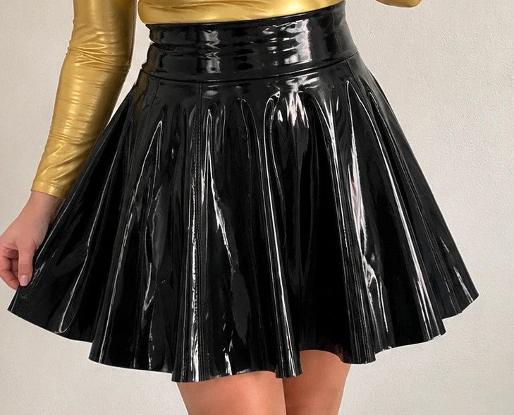 Che black high waist pleated skirt in glossy patent finish with back zipper.