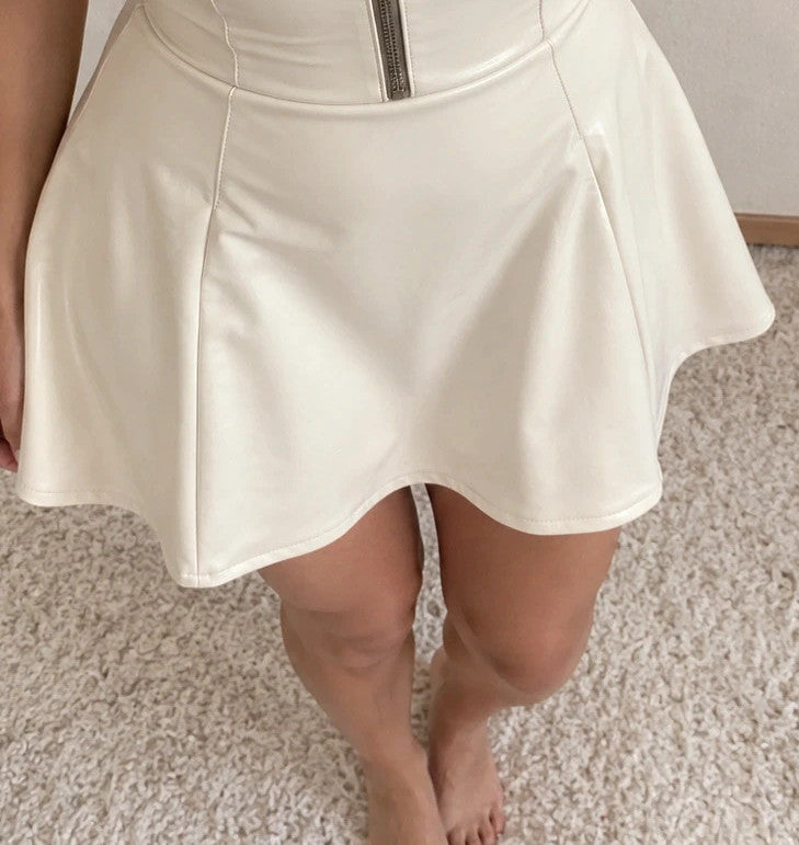 Creme bandage dress cream matte leather look deep V-neck backless with zippers.