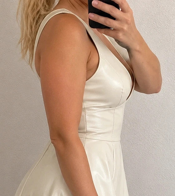Creme bandage dress cream matte leather look deep V-neck backless with zippers.