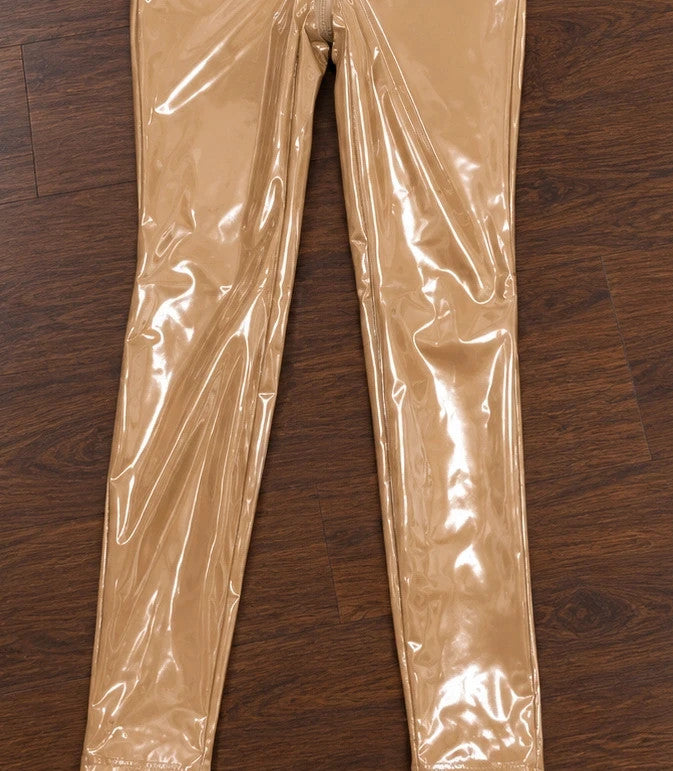 Beige jumpsuit with long sleeves, fitted silhouette, and standing collar.