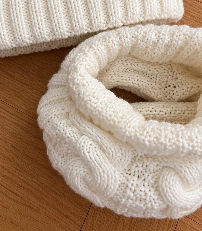 Off-White cream hat and neck warmer set with cable knit pattern, soft polyester material.