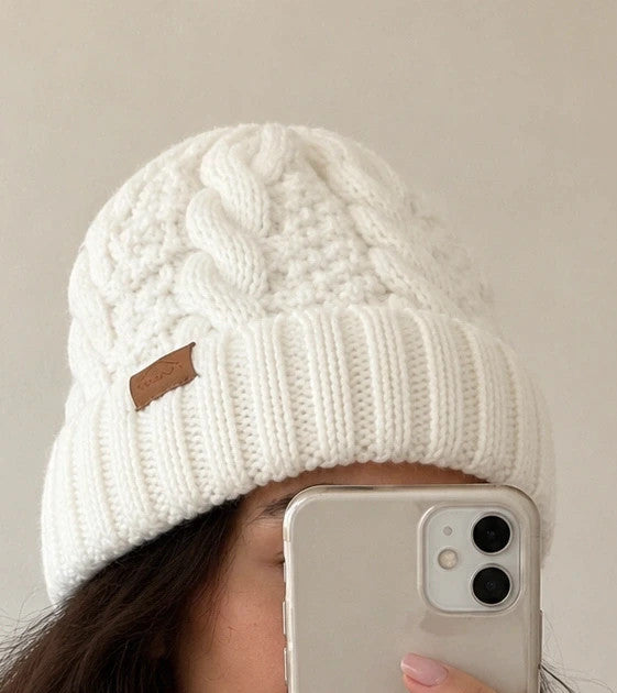 Off-White cream hat and neck warmer set with cable knit pattern, soft polyester material.