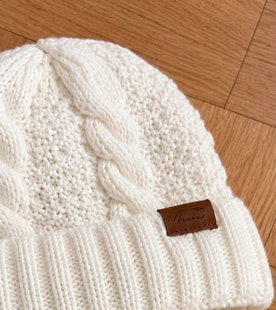 Off-White cream hat and neck warmer set with cable knit pattern, soft polyester material.