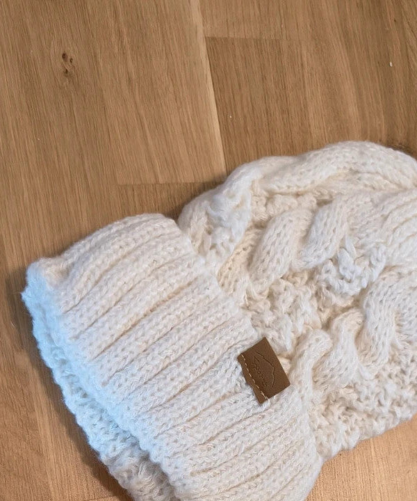 Off-White cream hat and neck warmer set with cable knit pattern, soft polyester material.