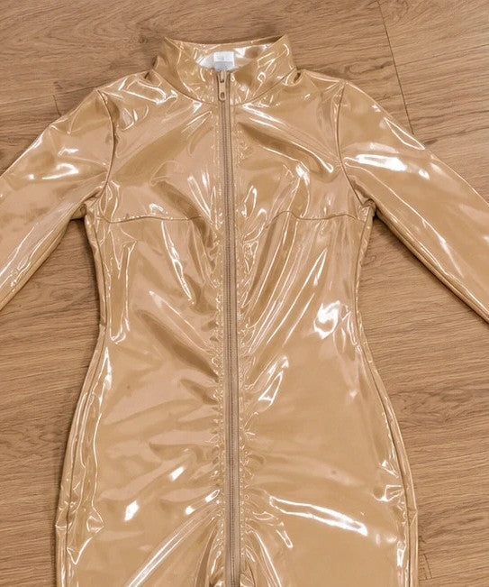 XXL beige jumpsuit with long sleeves, standing collar, and body-hugging fit.