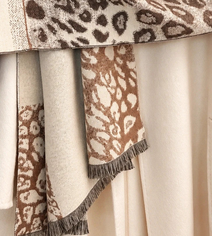 Muster beige brown shawl leopard pattern soft polyester with decorative fringes.