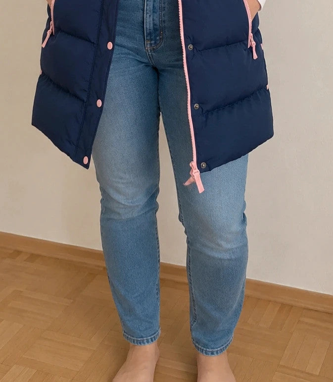 Lagooners navy vest with pink accents, quilted design, logo on chest, hooded.