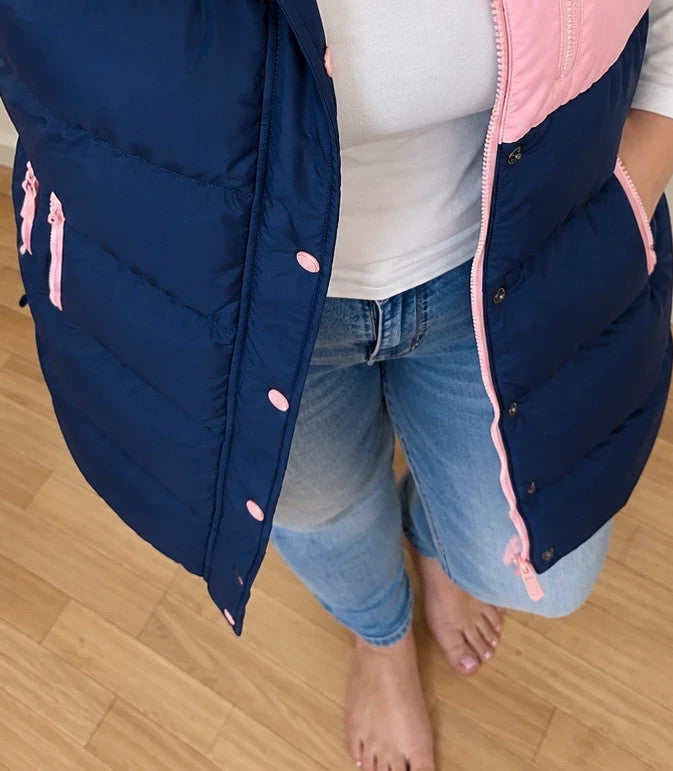 Lagooners navy vest with pink accents, quilted design, logo on chest, hooded.