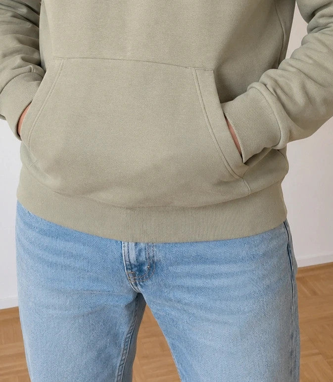 Bench green hoodie with rubber logo, kangaroo pocket, and thumbholes.
