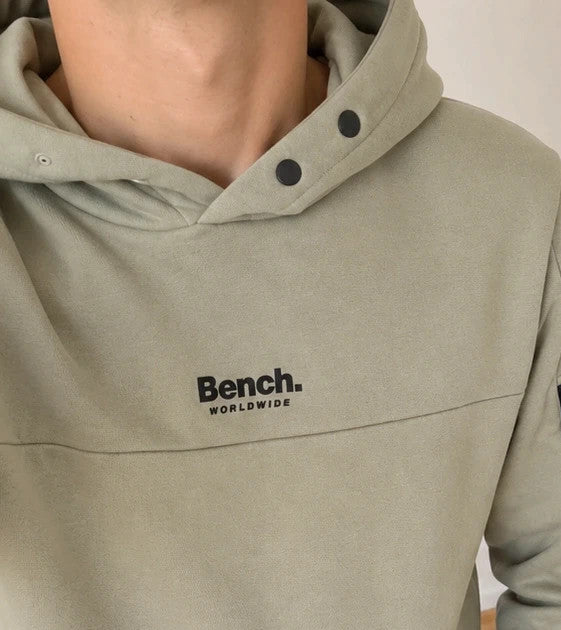 Bench green hoodie with rubber logo, kangaroo pocket, and thumbholes.